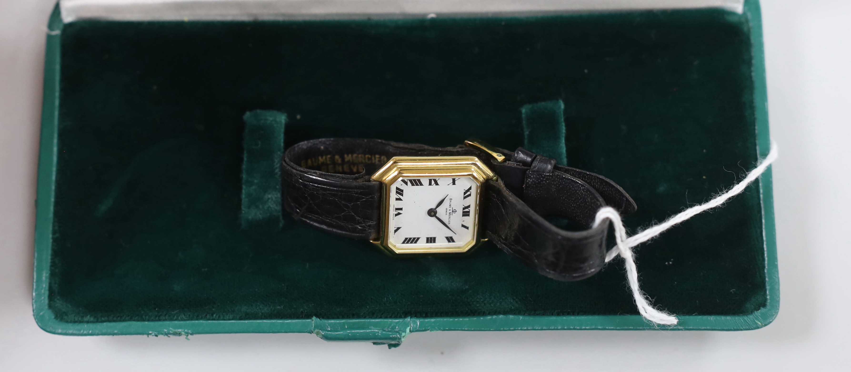 A lady's 750 yellow metal Baume & Mercier manual wind octagonal wrist watch, on a Baume & Mercier leather strap, case diameter 25mm, with Baume & Mercier box.